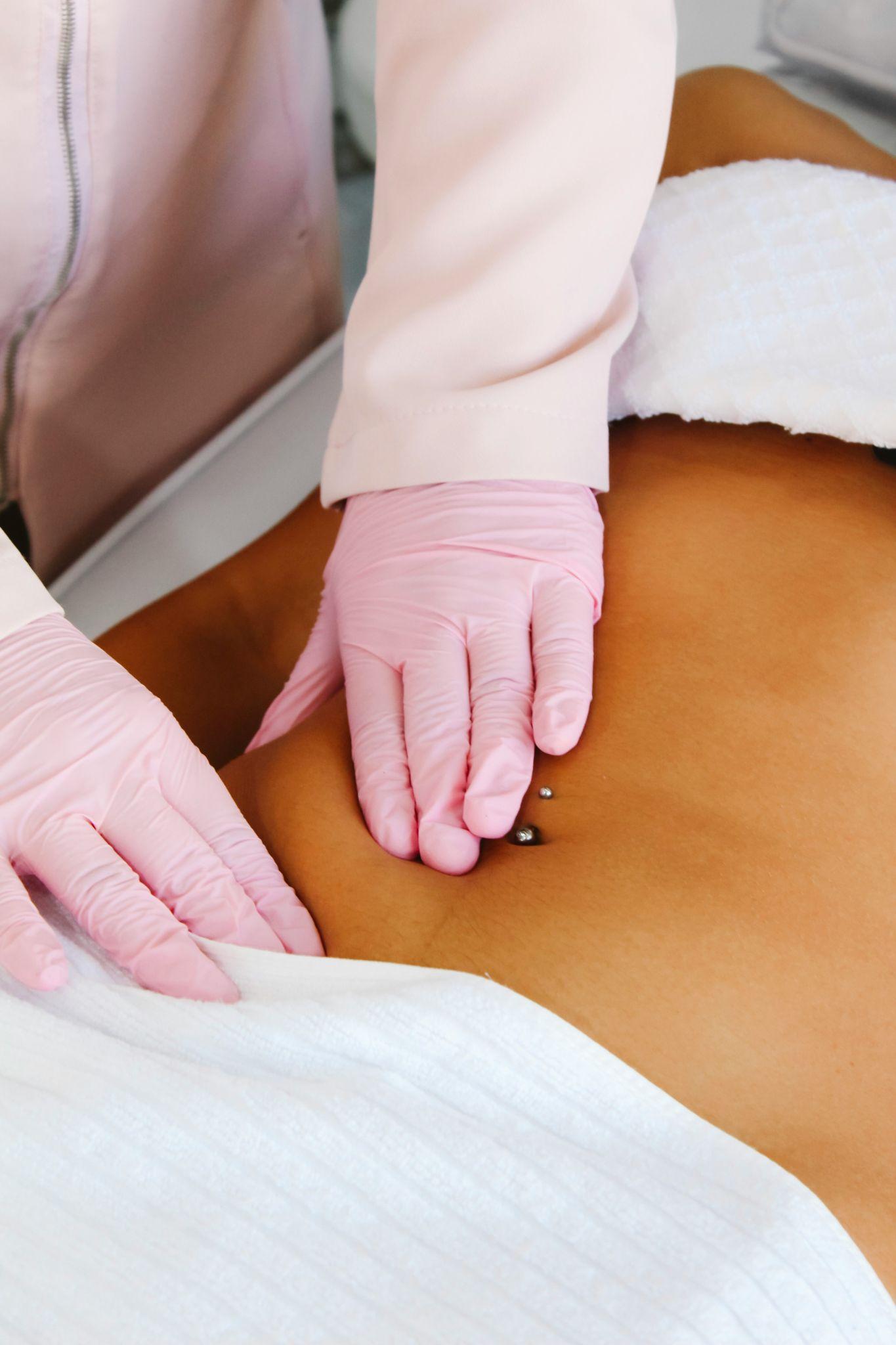 A woman relaxes by the pool, highlighting the aesthetic goals of body contouring in Summerlin.