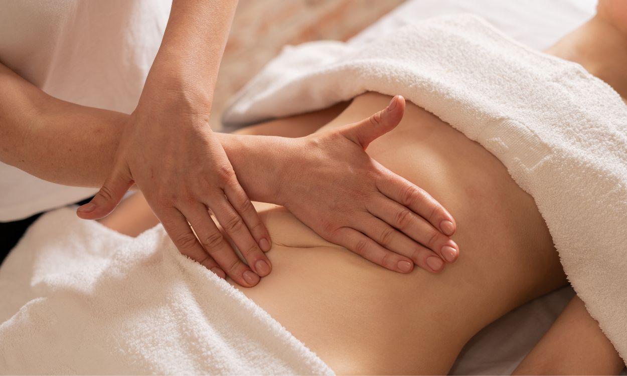 Professional therapist performing lymphatic massage in Las Vegas during a bodywork session.