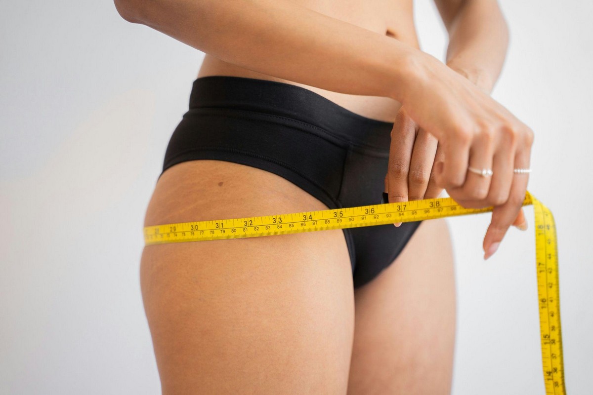Woman showcasing results associated with body sculpting in Summerlin.