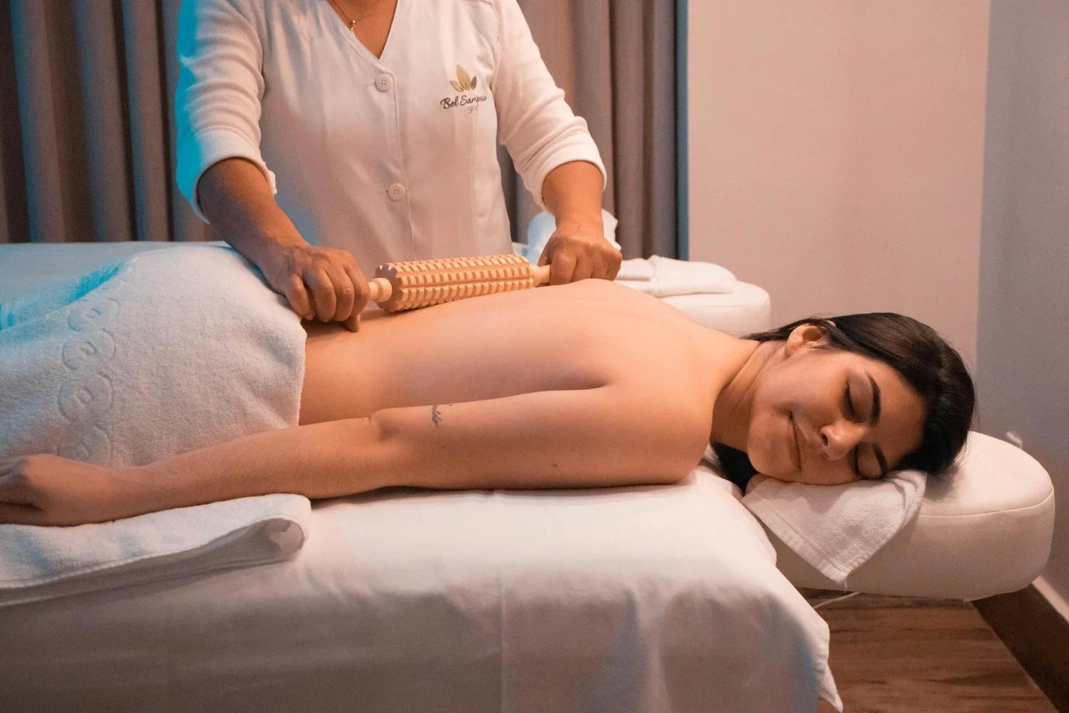 Professional wood therapy in Las Vegas session using specialized wooden massage tools.